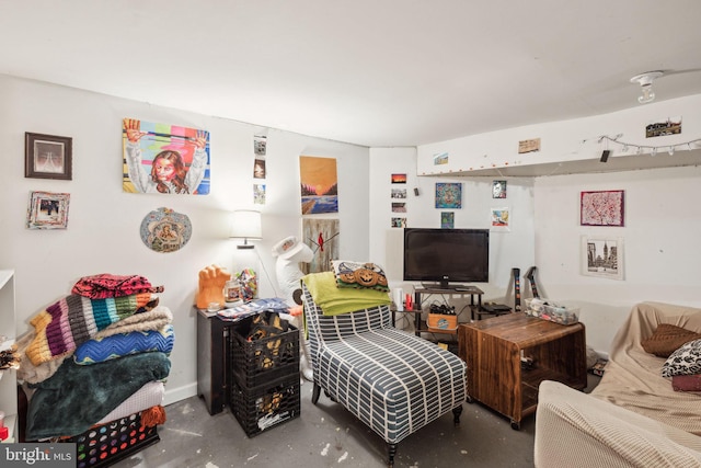 living room with concrete floors