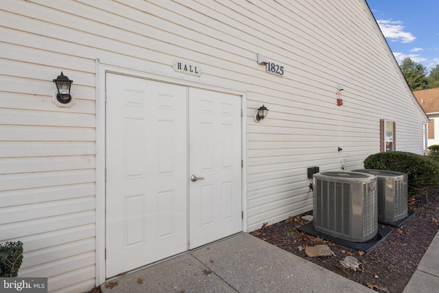 entrance to property featuring central air condition unit