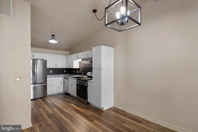 kitchen with white cabinets, decorative light fixtures, stainless steel appliances, and dark wood-type flooring