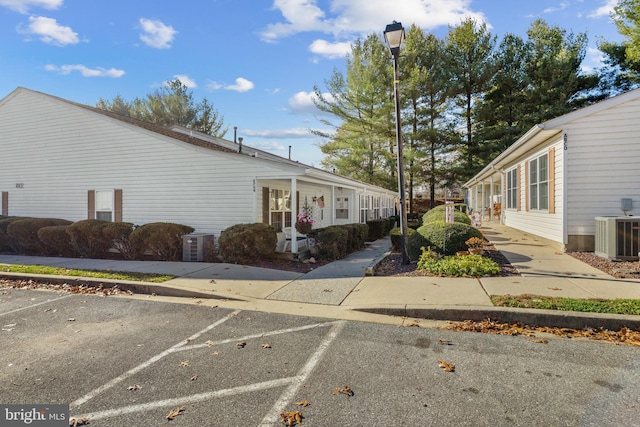 view of side of home with central AC unit