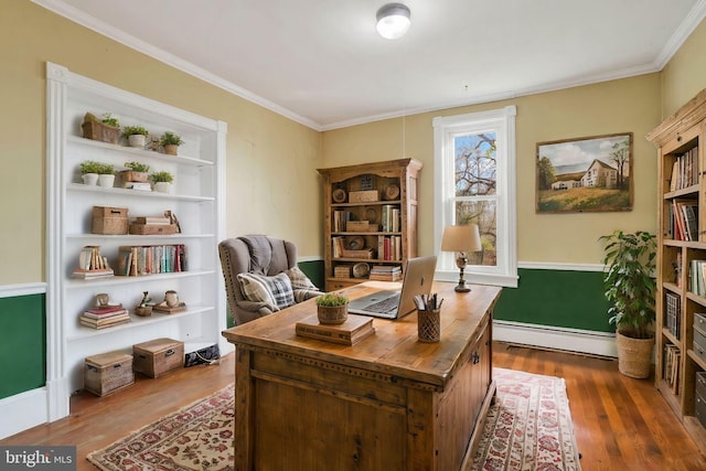 office featuring baseboard heating, crown molding, and dark hardwood / wood-style flooring