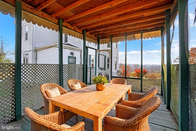 sunroom / solarium with beamed ceiling