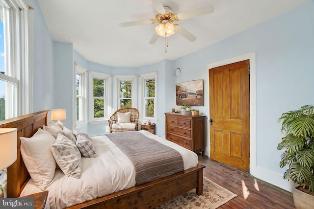 bedroom with hardwood / wood-style floors and ceiling fan