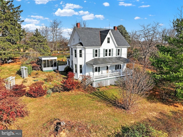 exterior space featuring a sunroom