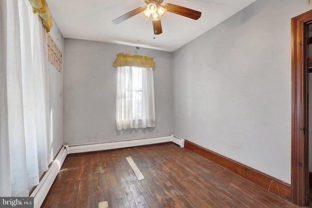 empty room with ceiling fan, dark hardwood / wood-style flooring, and a baseboard radiator