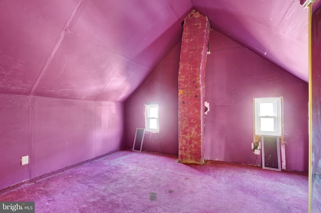 bonus room featuring a wealth of natural light, carpet, and lofted ceiling