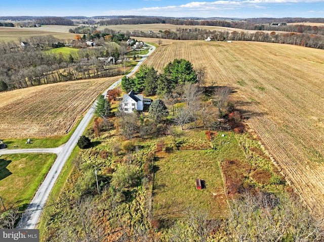 birds eye view of property with a rural view