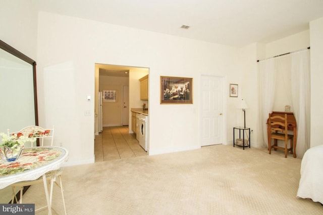 interior space with connected bathroom and washer / clothes dryer