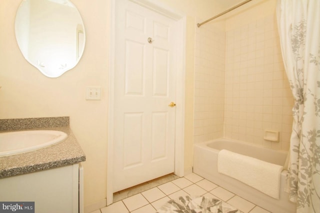 bathroom with vanity, tile patterned floors, and shower / bath combo with shower curtain