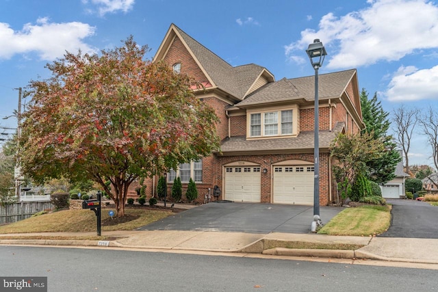 7238 Farr St, Annandale, VA 22003 - view of front facade featuring an attached garage, asphalt driveway, brick siding, and a shingled roof
