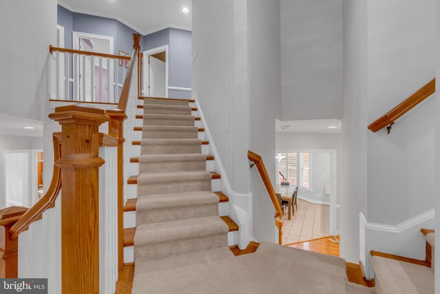 7238 Farr St, Annandale, VA 22003 - stairway with a high ceiling, baseboards, and recessed lighting