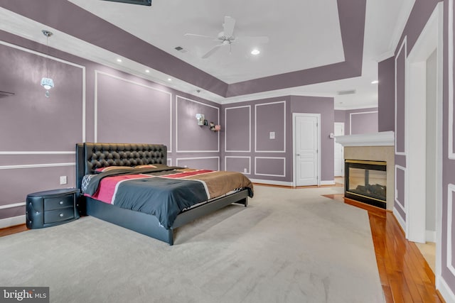 7238 Farr St, Annandale, VA 22003 - bedroom with a decorative wall, wood finished floors, a multi sided fireplace, crown molding, and recessed lighting