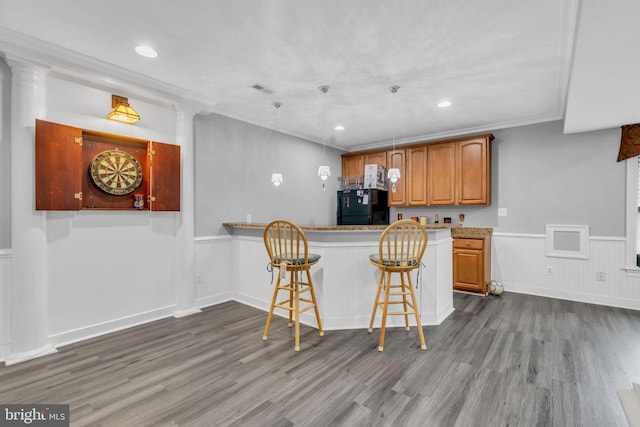 7238 Farr St, Annandale, VA 22003 - kitchen featuring freestanding refrigerator, dark wood finished floors, a kitchen bar, recessed lighting, and a peninsula