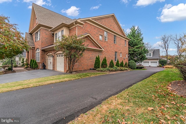 7238 Farr St, Annandale, VA 22003 - view of front of property featuring brick siding, driveway, and a garage