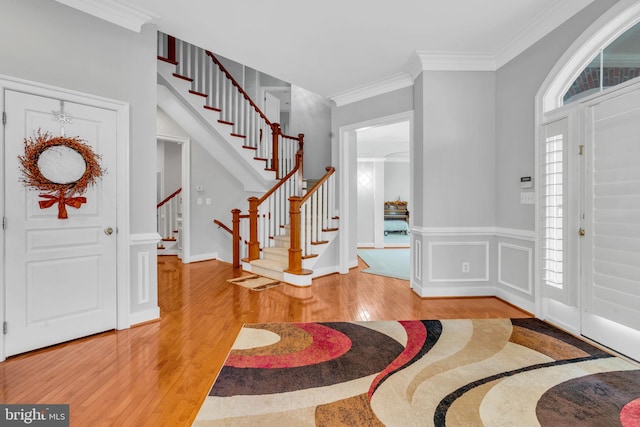 7238 Farr St, Annandale, VA 22003 - entrance foyer featuring wood finished floors, stairway, and crown molding