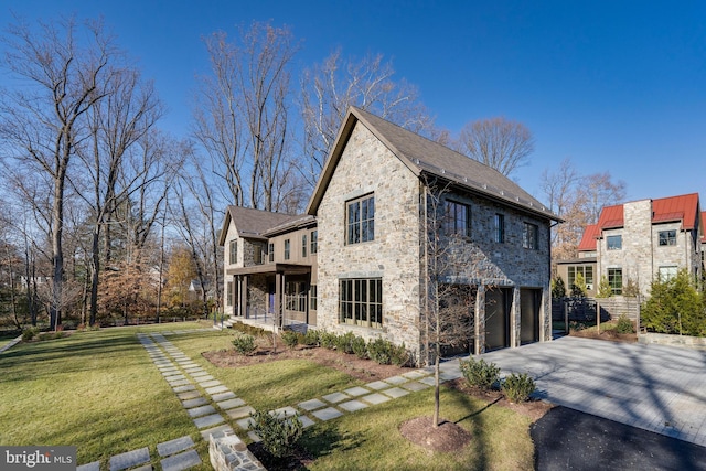 view of property exterior featuring a porch, a garage, and a yard