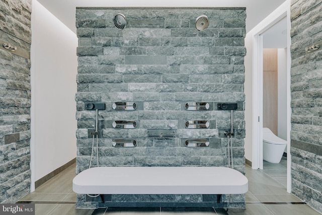 bathroom featuring tile patterned floors and toilet