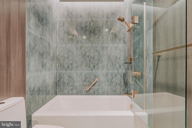 bathroom featuring shower / bathing tub combination and toilet