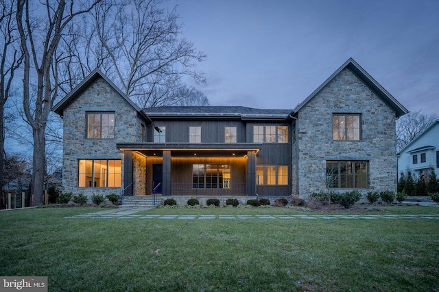 view of front of property with a lawn