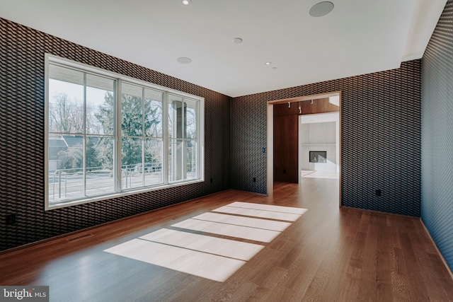 spare room featuring hardwood / wood-style floors