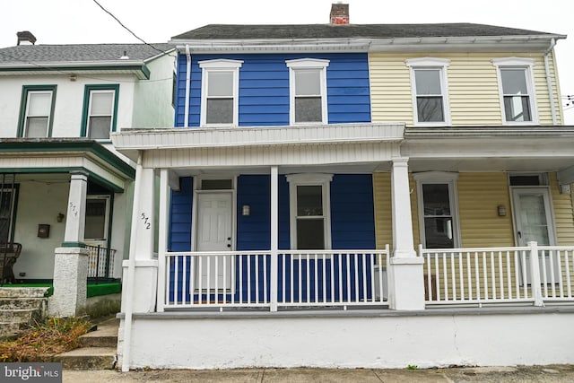 townhome / multi-family property with covered porch