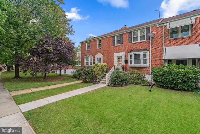 view of property with a front lawn