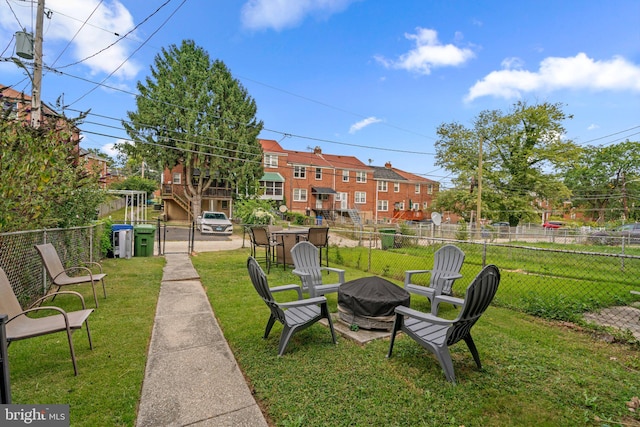 view of yard with an outdoor fire pit