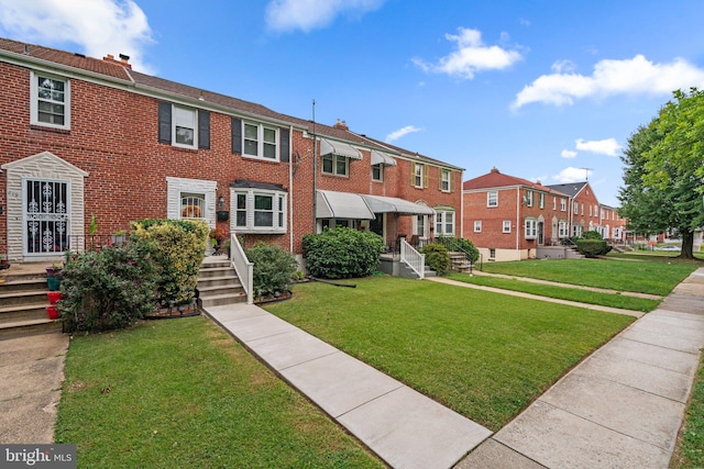 view of front of property featuring a front yard