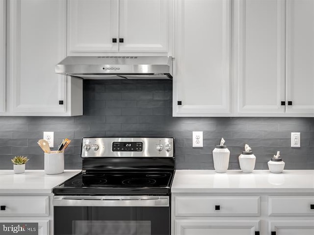 kitchen with white cabinetry, stainless steel electric range oven, range hood, and tasteful backsplash