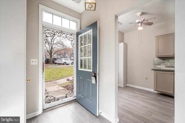 foyer featuring light wood-type flooring and ceiling fan