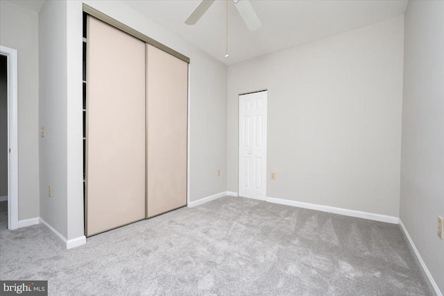 unfurnished bedroom with ceiling fan and light carpet