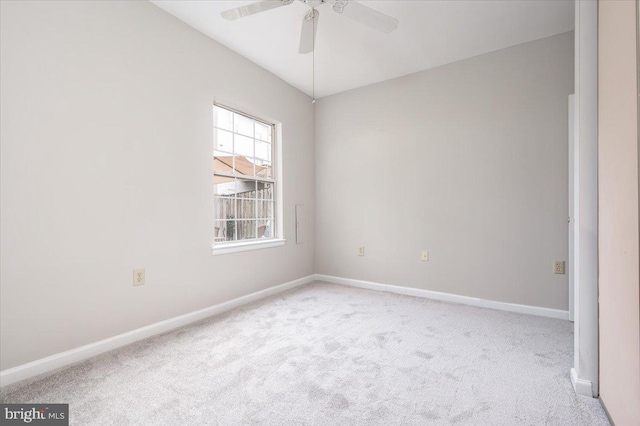 carpeted empty room with ceiling fan