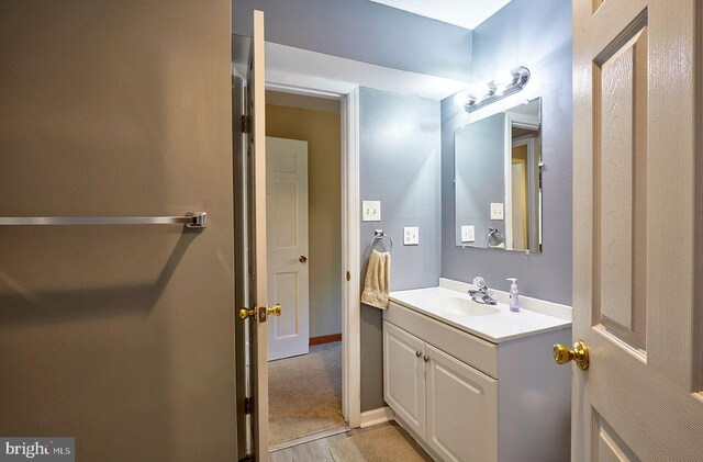 bathroom featuring wood-type flooring and vanity