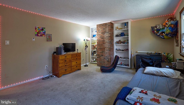 bedroom with a textured ceiling and light colored carpet