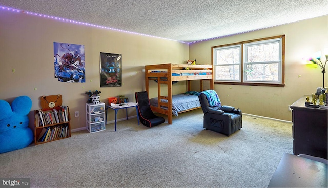 carpeted bedroom with a textured ceiling