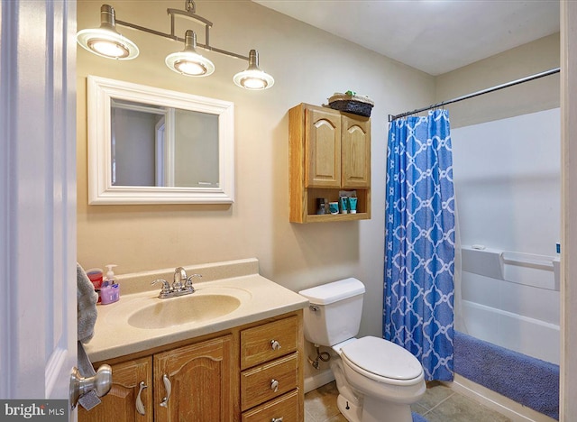 bathroom featuring tile patterned floors, vanity, and toilet