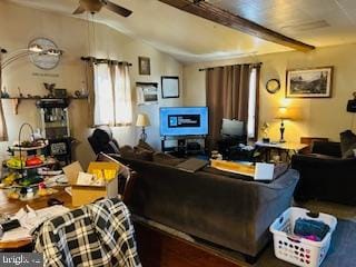 living room featuring lofted ceiling with beams and ceiling fan