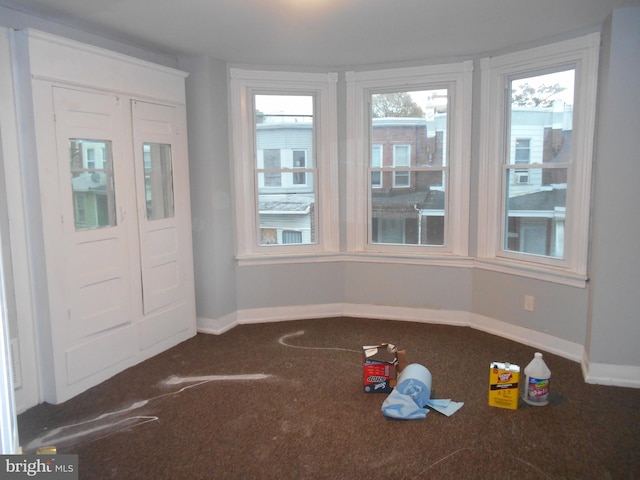 view of carpeted foyer entrance