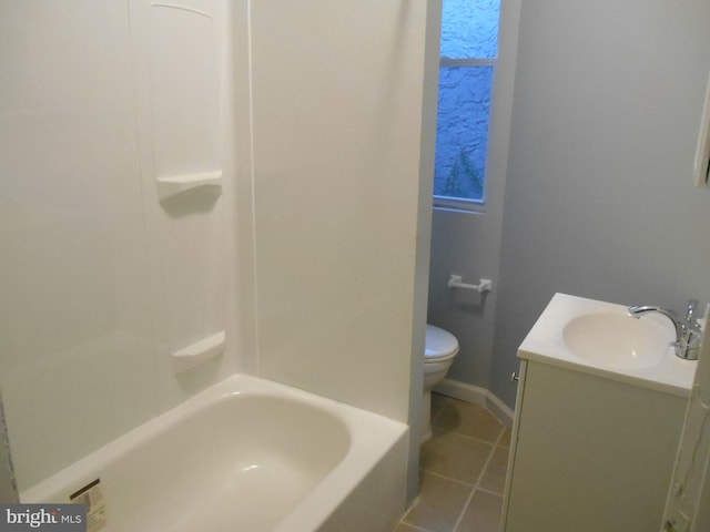 full bathroom featuring tile patterned flooring, bathtub / shower combination, vanity, and toilet