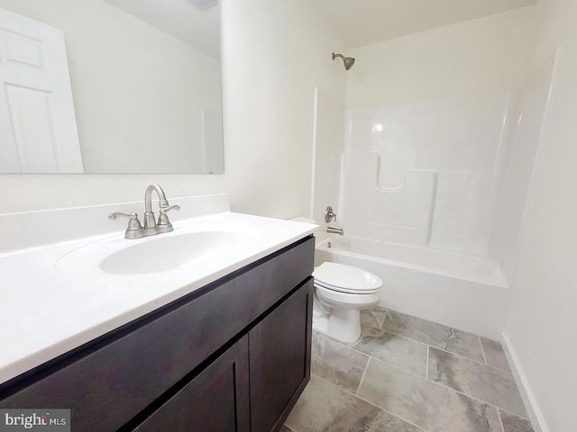 full bathroom with vanity, washtub / shower combination, and toilet