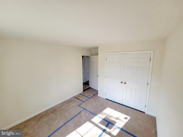 unfurnished bedroom with a closet