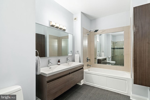 full bathroom featuring separate shower and tub, vanity, and toilet