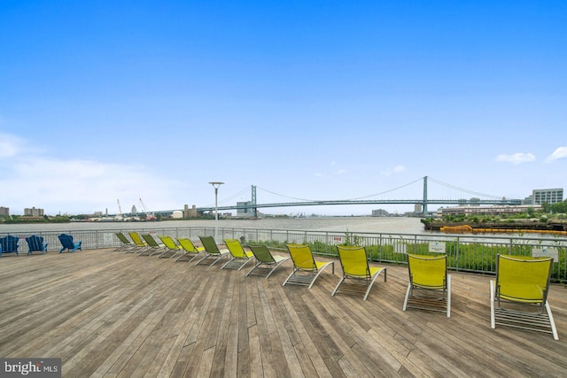 wooden deck featuring a water view