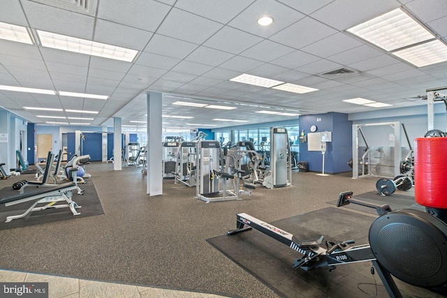 exercise room featuring a paneled ceiling