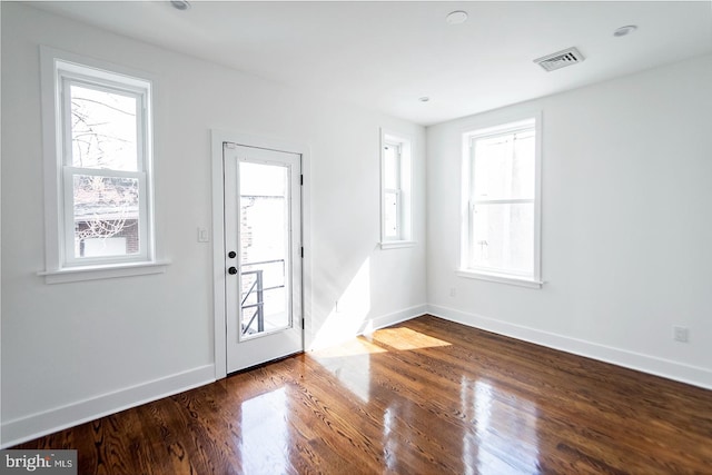 foyer entrance with hardwood / wood-style floors