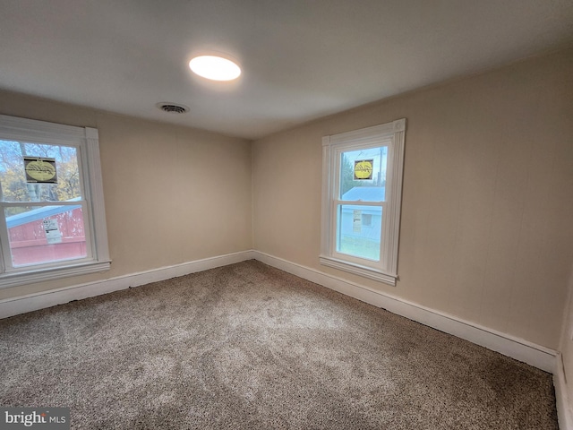 empty room featuring carpet flooring