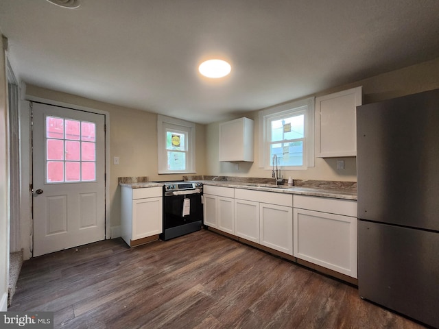 kitchen with white cabinets, dark hardwood / wood-style floors, sink, and stainless steel appliances