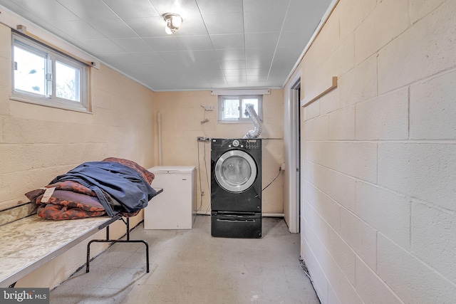 clothes washing area with washing machine and dryer