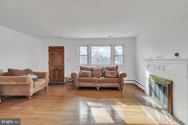 living room featuring a fireplace and light hardwood / wood-style flooring