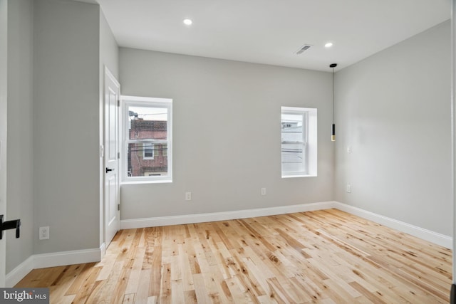 unfurnished room featuring light hardwood / wood-style flooring